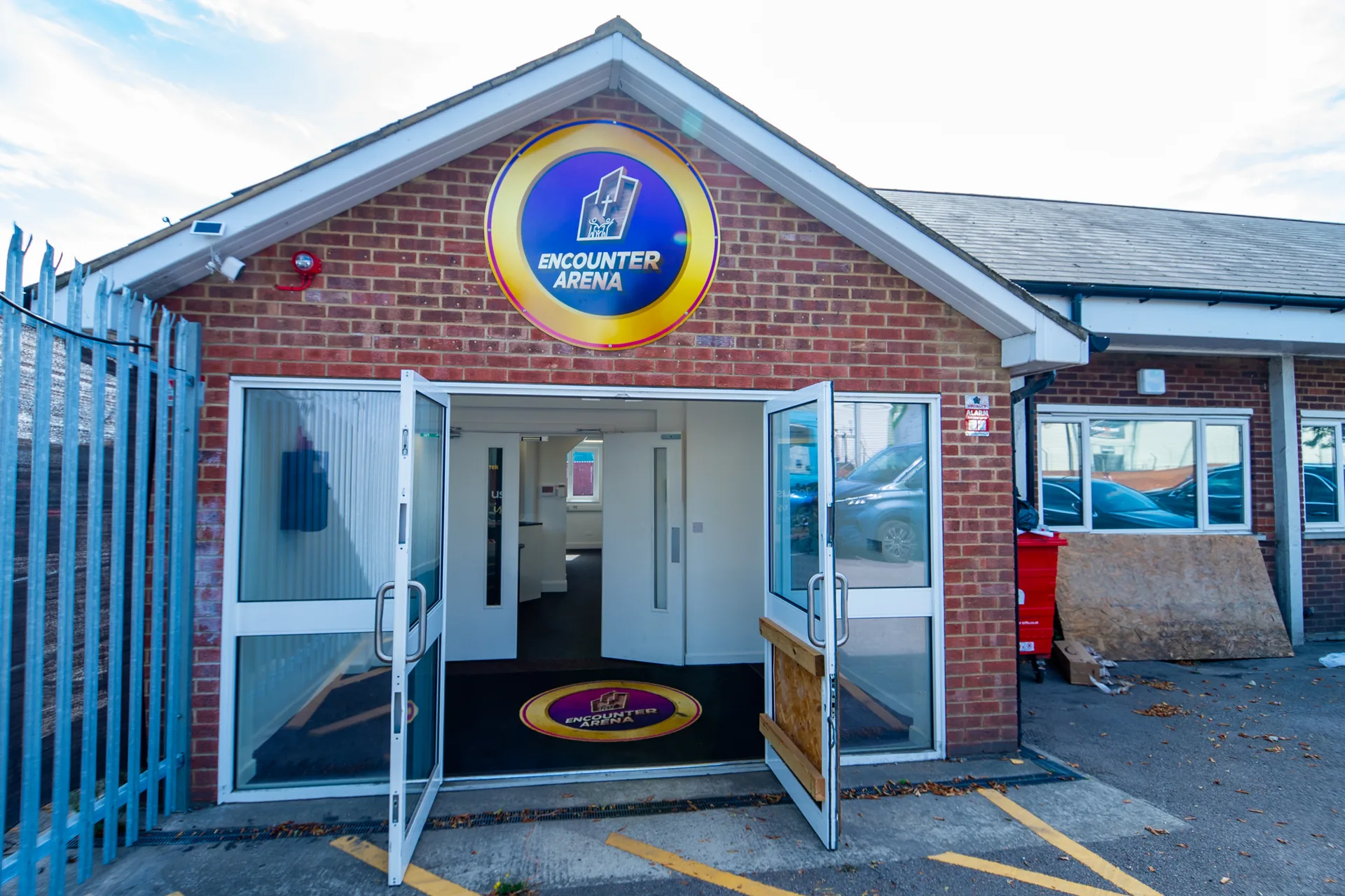 Open entrance doors beneath the Encounter Arena sign