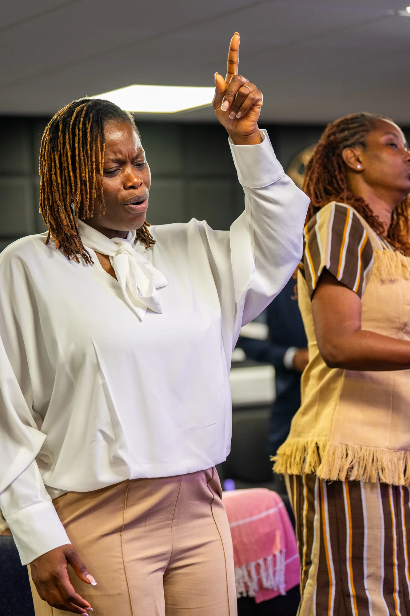 Congregation members standing during a church service